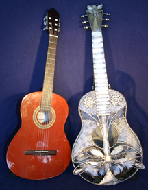 This is a special area for 
three dimensional art...These guitars were inspired by an appreciation and lifelong 
exposure to music. The guitars featured here are guitar size. Delightful for display, adorning a wall or placed on a guitar stand.
Yet they lack acoustics...
wish we could play a 'G' chord for ya~!