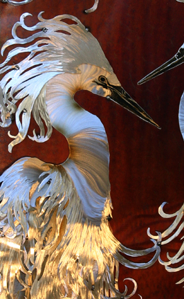 Detail of the white egret on the left with it's special head flair.